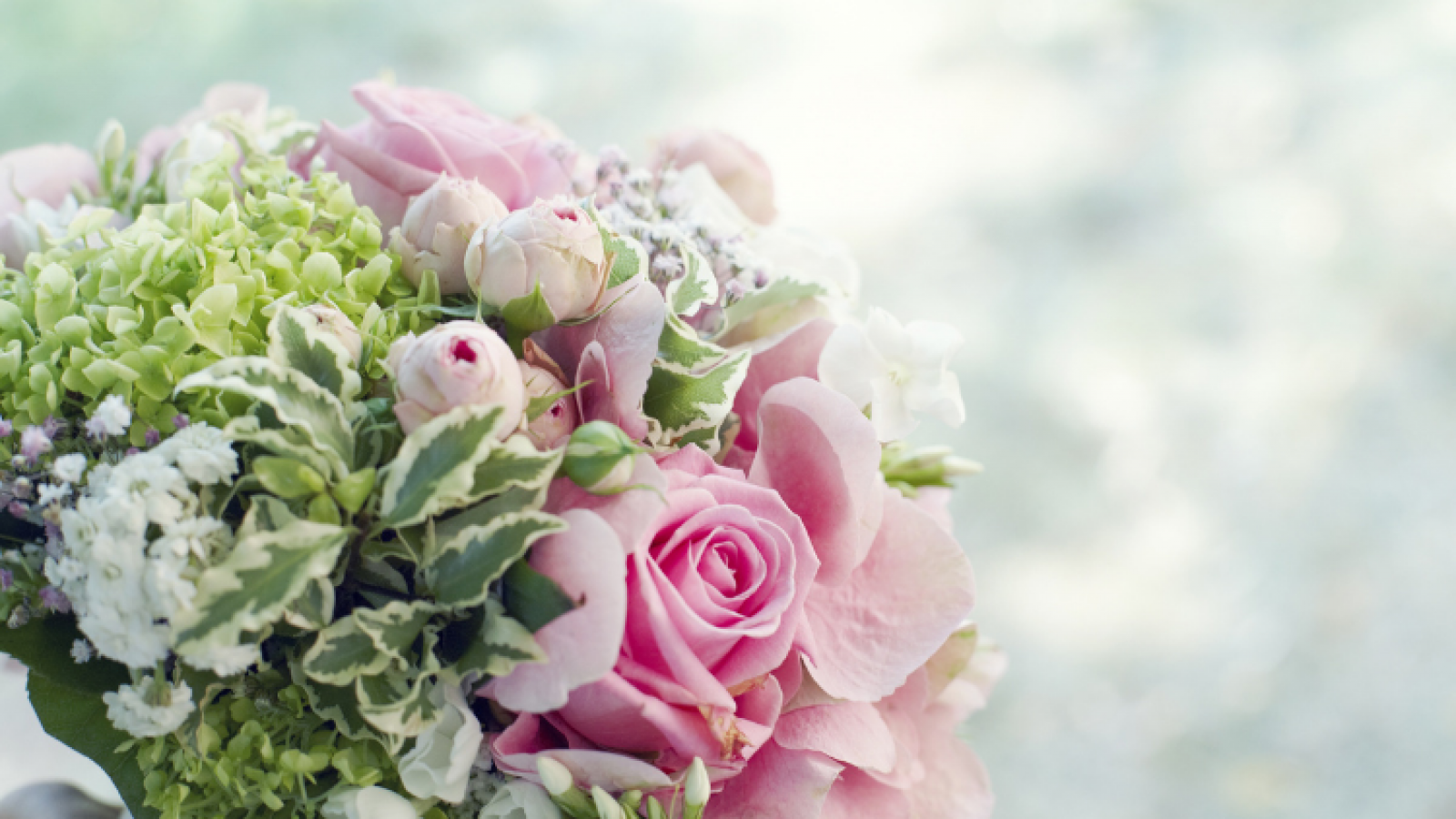 Photo of a bouquet of pink , white and green flowers
